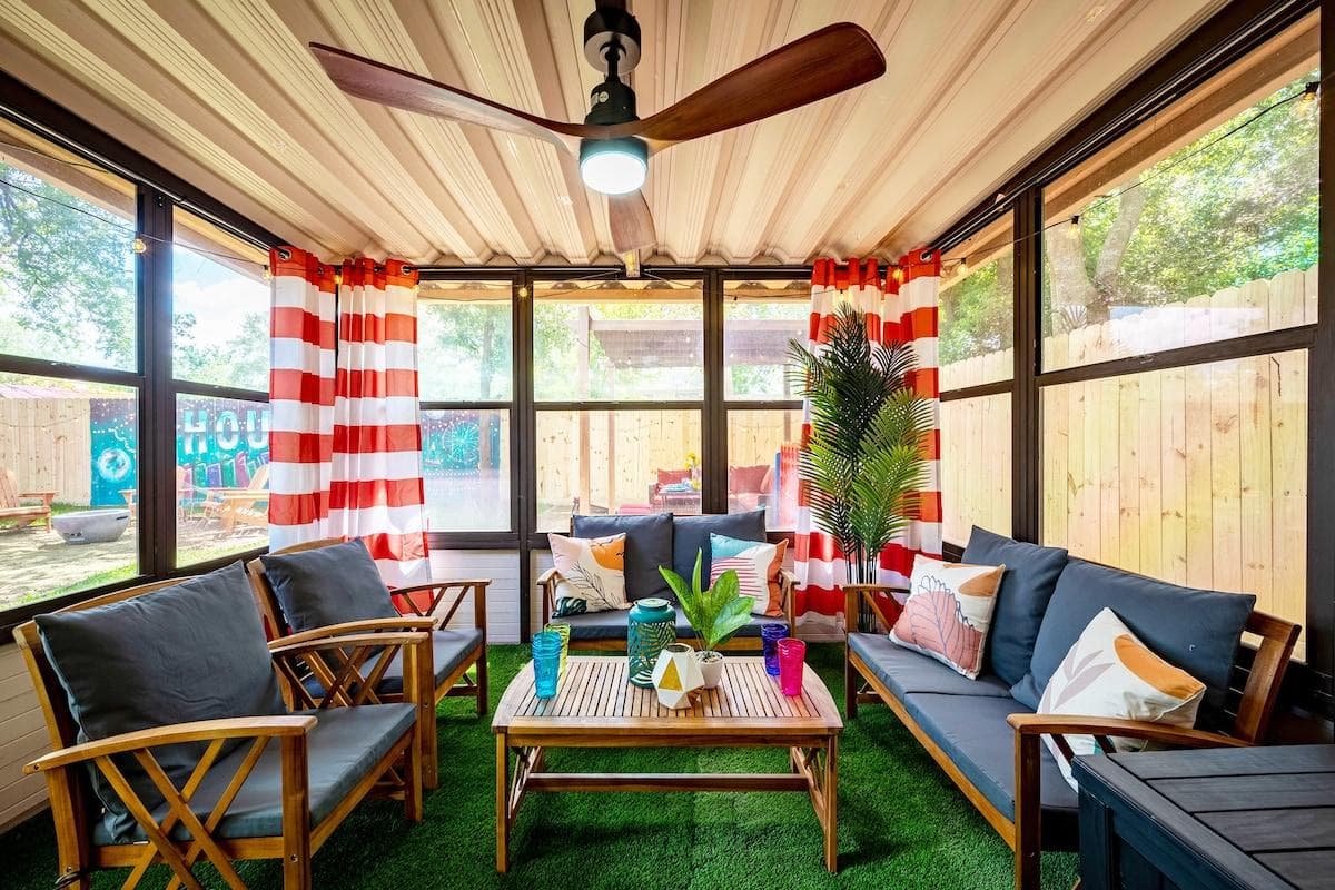 Retreat to our Enclosed Porch Lounge, a Tranquil Haven to Enjoy the Outdoors in Comfort and Privacy